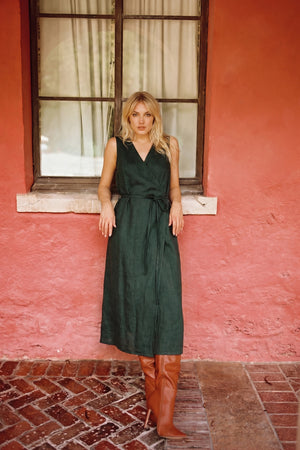 Model is wearing Linen smoke pine wrap dress