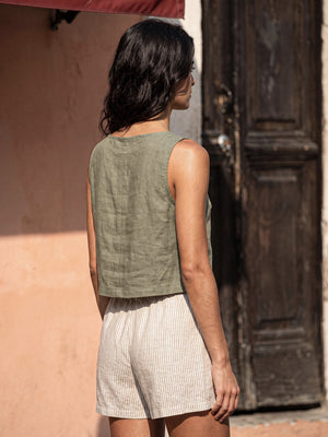 Back view of the VIDA eucalyptus green sleeveless linen crop top by SONFRÉ, showing the clean vertical center seam.
