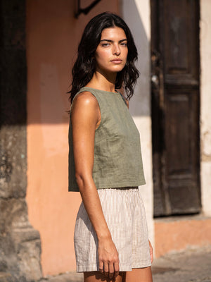 Close-up side view of the VIDA eucalyptus green sleeveless linen crop top by SONFRÉ, highlighting the relaxed fit.