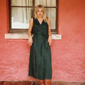 Model is wearing Linen smoke pine wrap dress