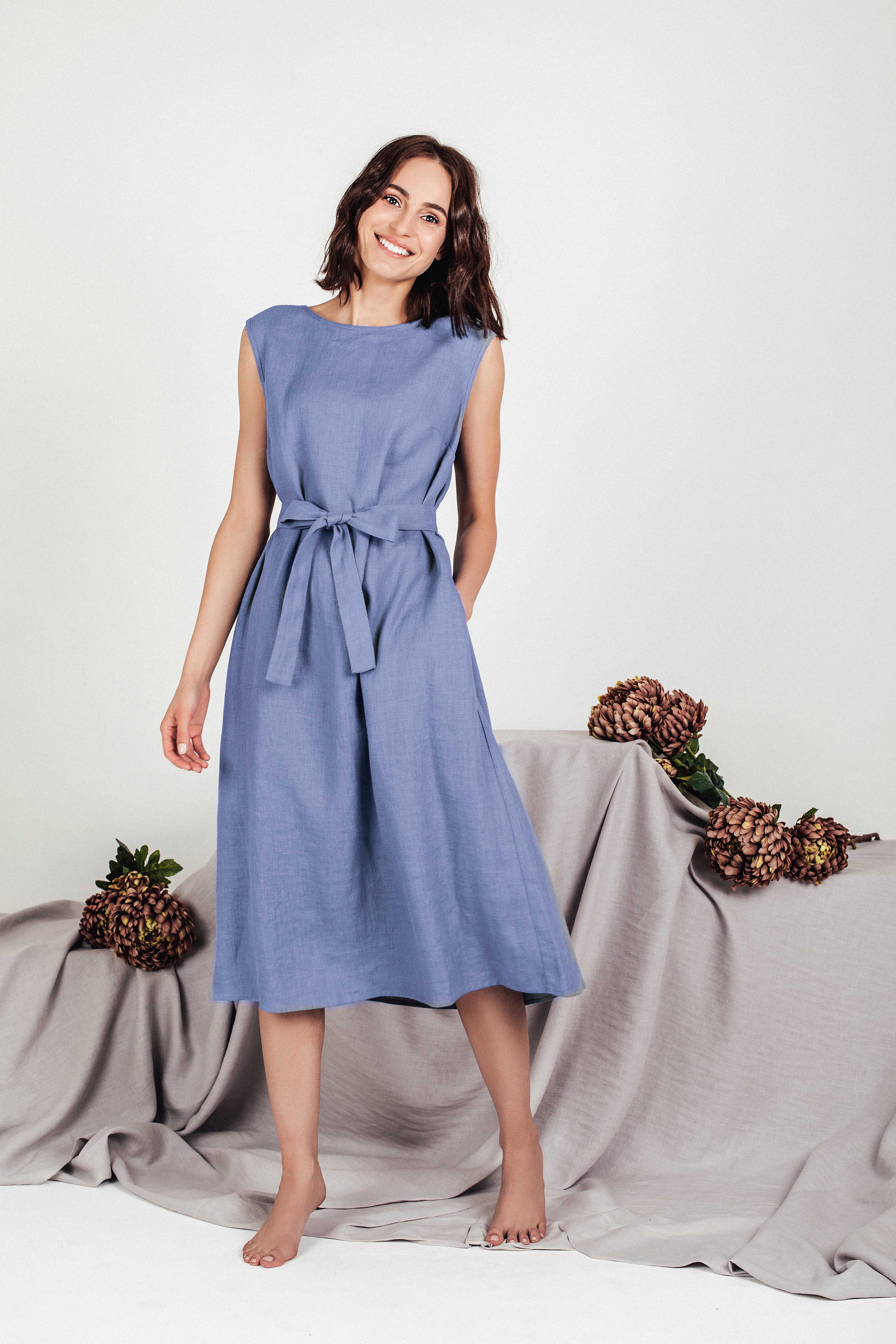 Front view of the LINUVA sleeveless linen midi dress in denim blue, featuring a waist-cinching tie belt.