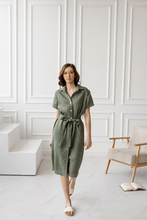 Linen shirt dress with short sleeves, button-up front, and adjustable belt, showcasing effortless and chic summer fashion