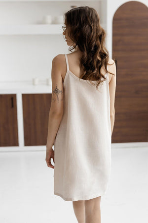Off-white linen nightdress, back view, relaxed fit, sleeveless.