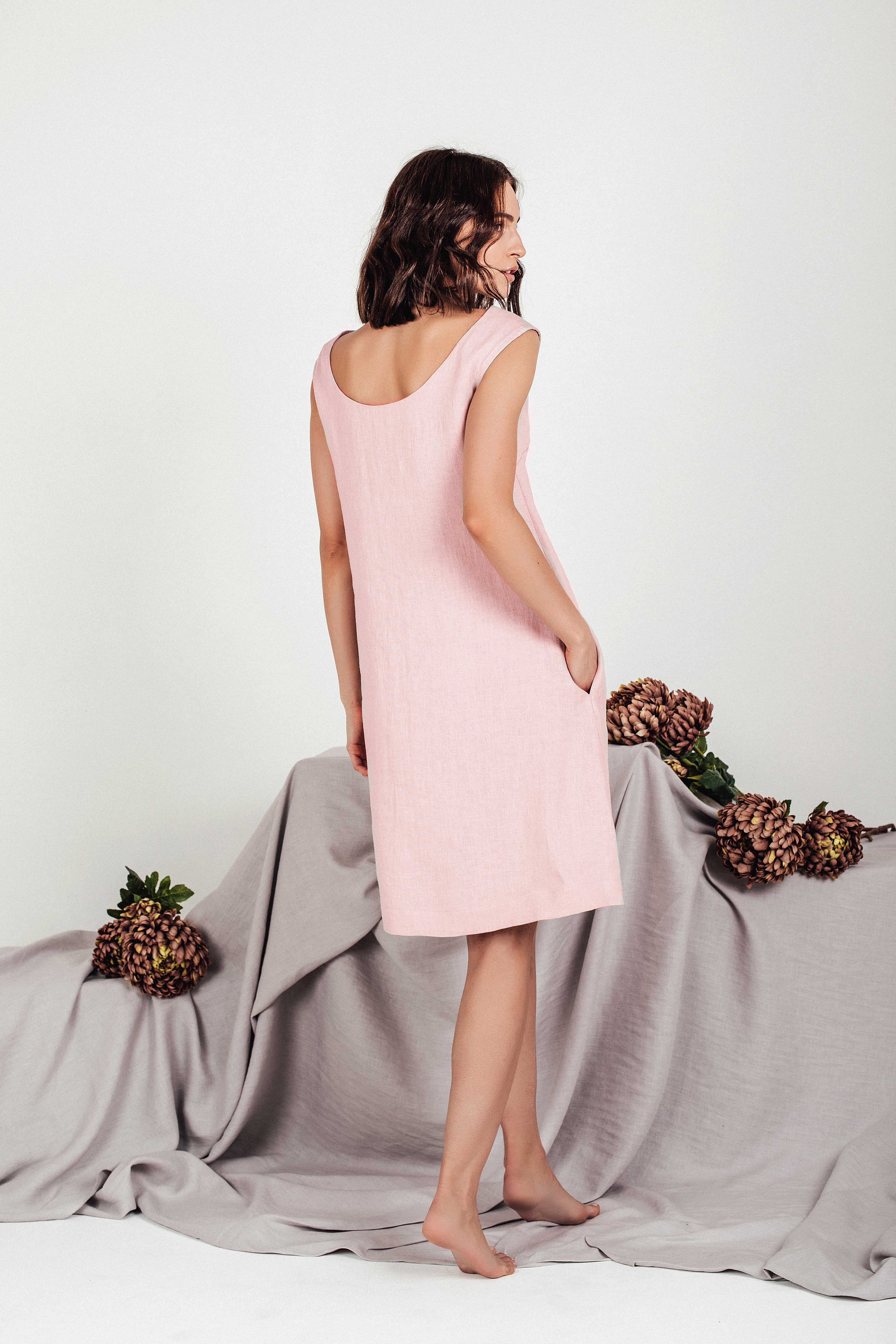 Back view of the VELA linen shift dress in dusty rose by SonFre, highlighting the elegant deep scoop back design and relaxed silhouette.