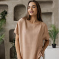 Women's boxy linen blouse in taupe, relaxed fit breathable top made from natural 100% linen. Features a minimalist round neckline, short sleeves, and a loose, oversized fit. Perfect for casual and chic styling in all seasons.